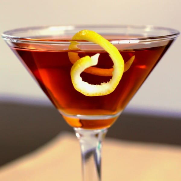 Closeup of Affinity Cocktail with lemon twist