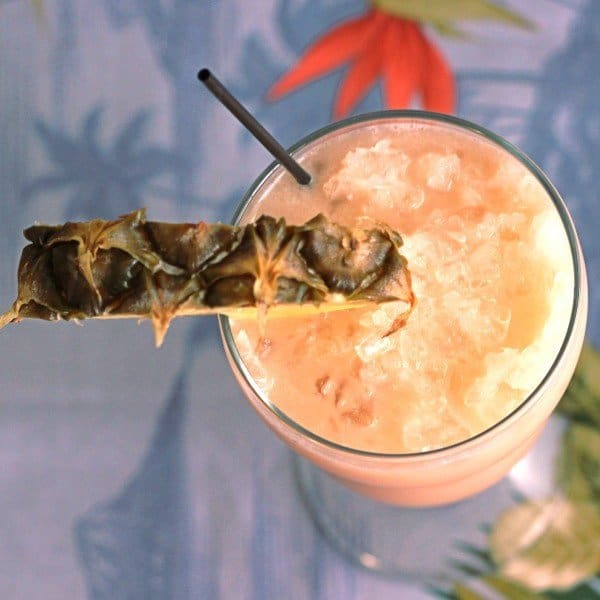 Overhead view of Amaretto Colada with pineapple slice