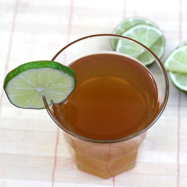 Overhead view of Ankle Breaker drink with limes