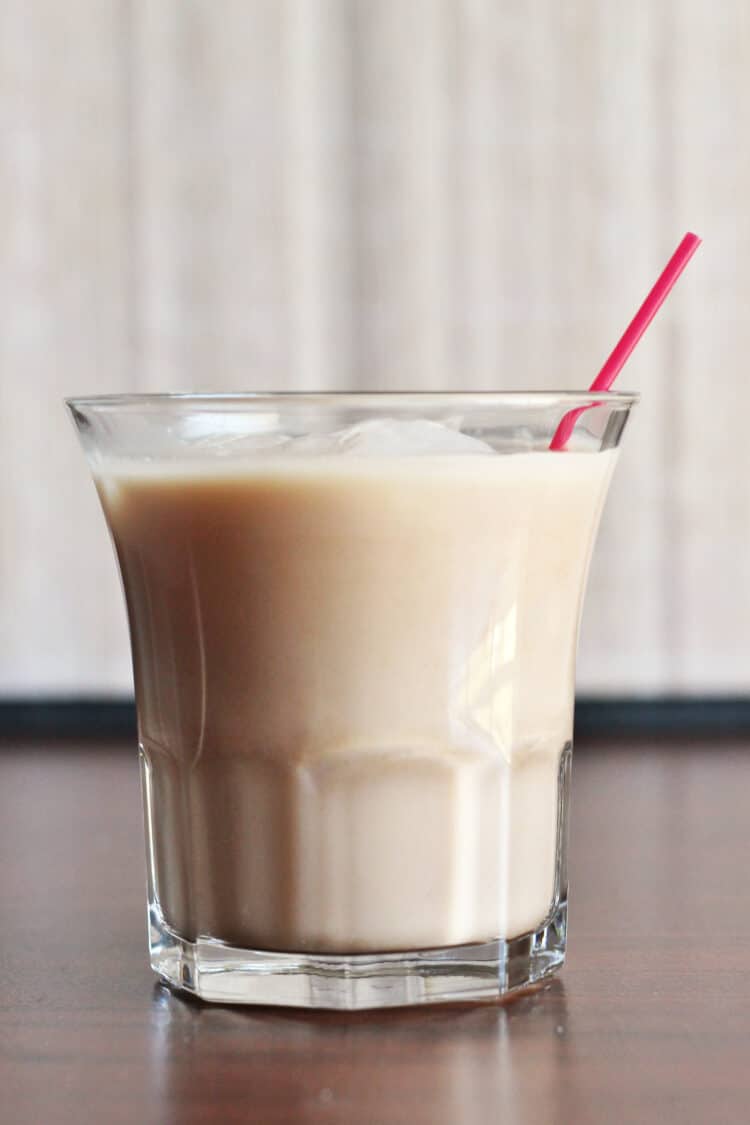 Avalanche Cocktail on table with red straw