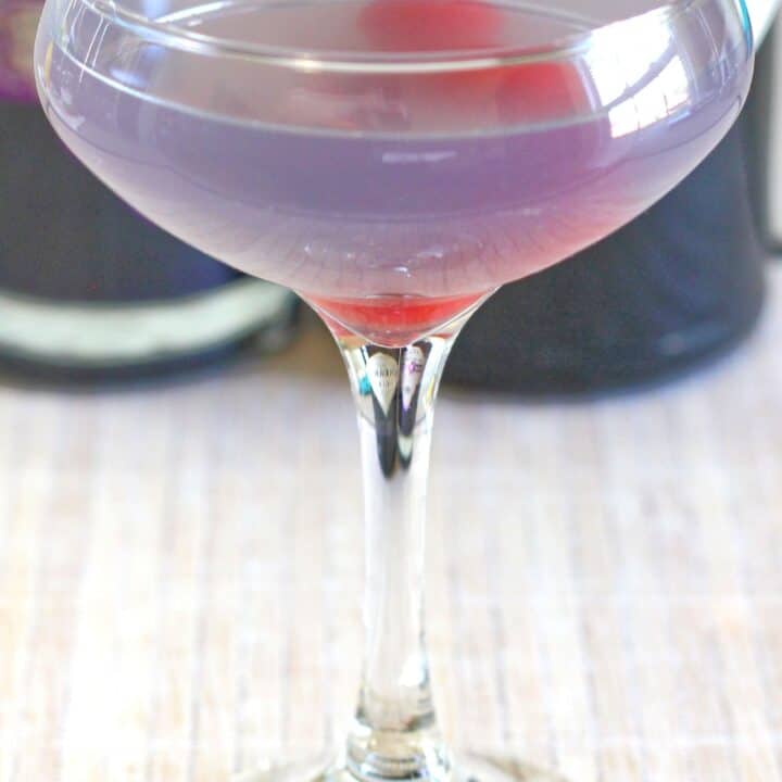 Pale violet Aviation cocktail with cherries