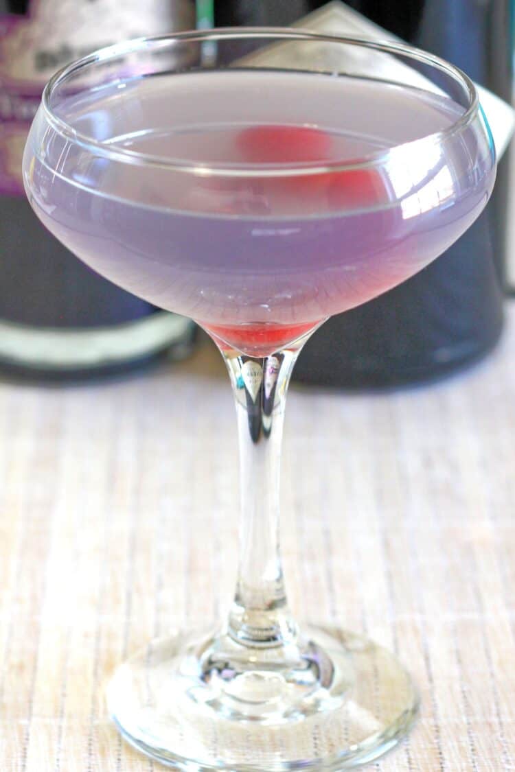 Pale violet Aviation cocktail with cherries