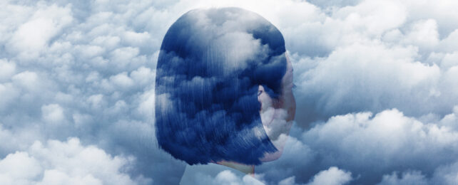 The back of a woman's head superimposed over a cloudy sky.