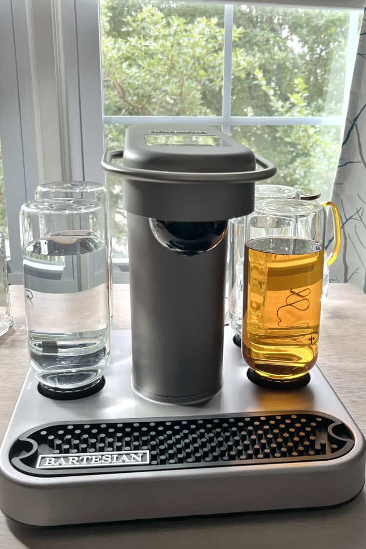 Bartesian cocktail maker machine on table in front of window