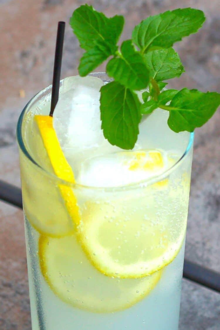 BBQ drink on patio table with mint garnish