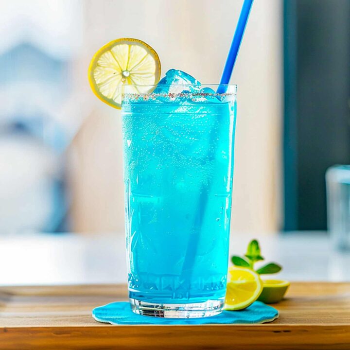 Blue Long Island Iced Tea sitting on coaster on bar