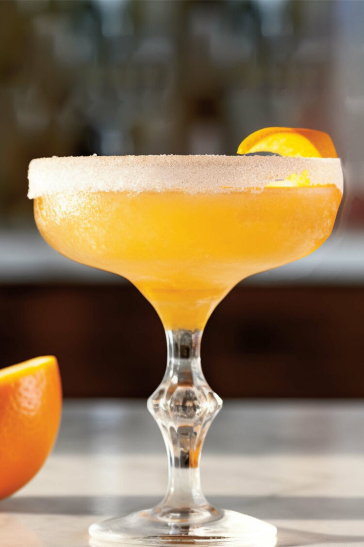 Brandy Crusta cocktail in coupe with orange twist