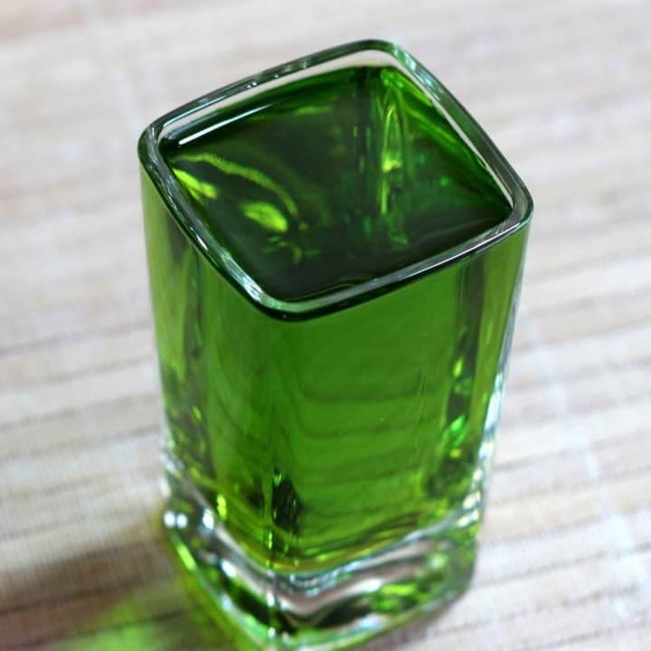 Broken Down Golf Cart in shot glass on table