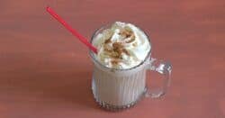 Butterscotch Coffee Cocktail with whipped cream and nutmeg sprinkles