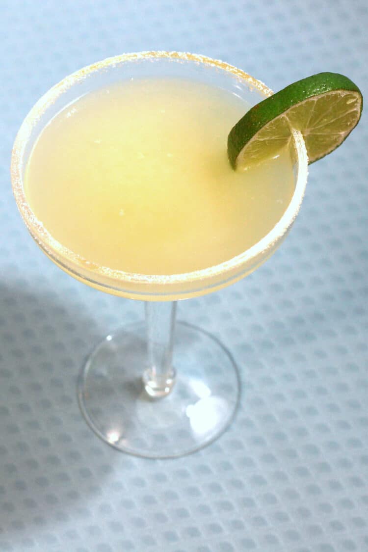 Cadillac Margarita with salt rim and lime wheel