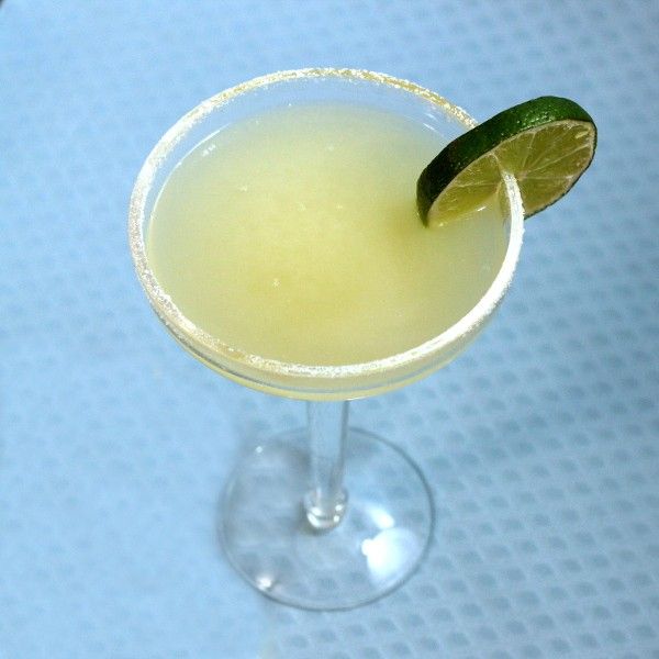 Cadillac Margarita with salt rim and lime wheel