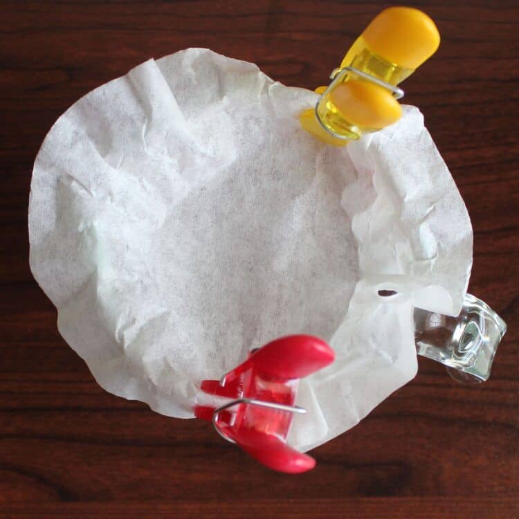 Coffee filter clipped to measuring cup