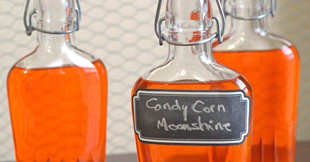 Candy Corn Moonshine in a glass with whipped cream