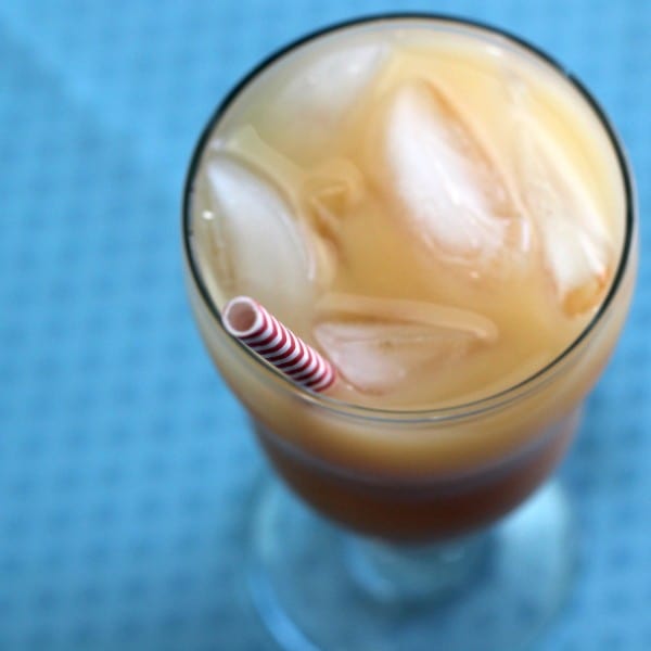 Overhead view of Captain Creamsicle drink with red and white paper straw