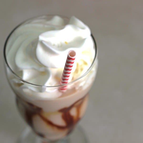 Angled view of Caramel J drink with whipped cream