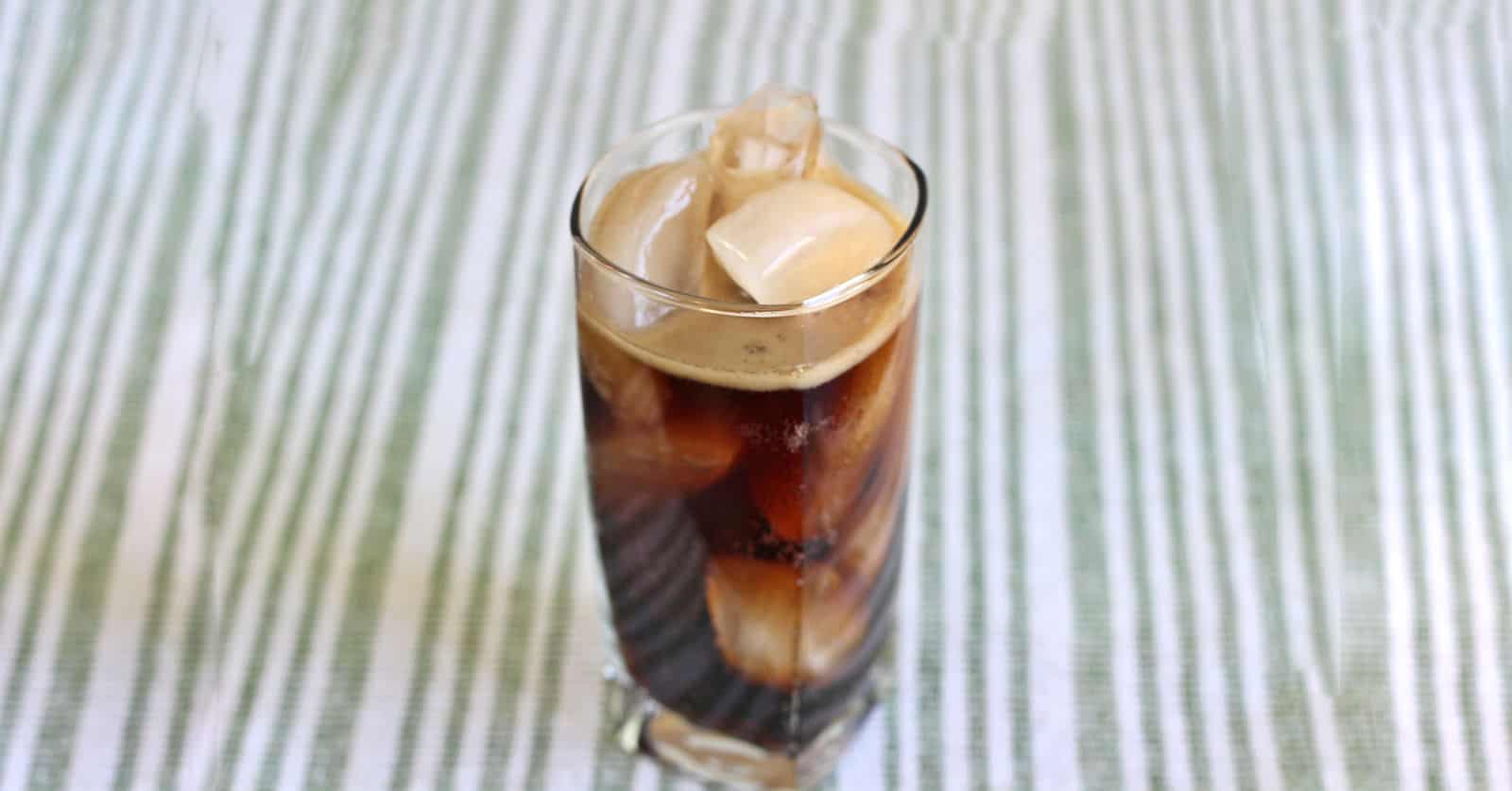 Chocolate Coke cocktail in tall glass with ice