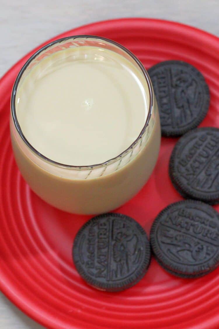 Christmas cocktail on plate with cookies