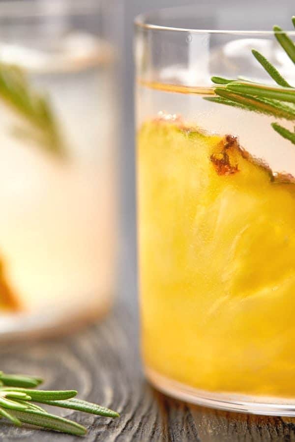 Closeup view of two glasses of Coconut Pineapple Martini on table