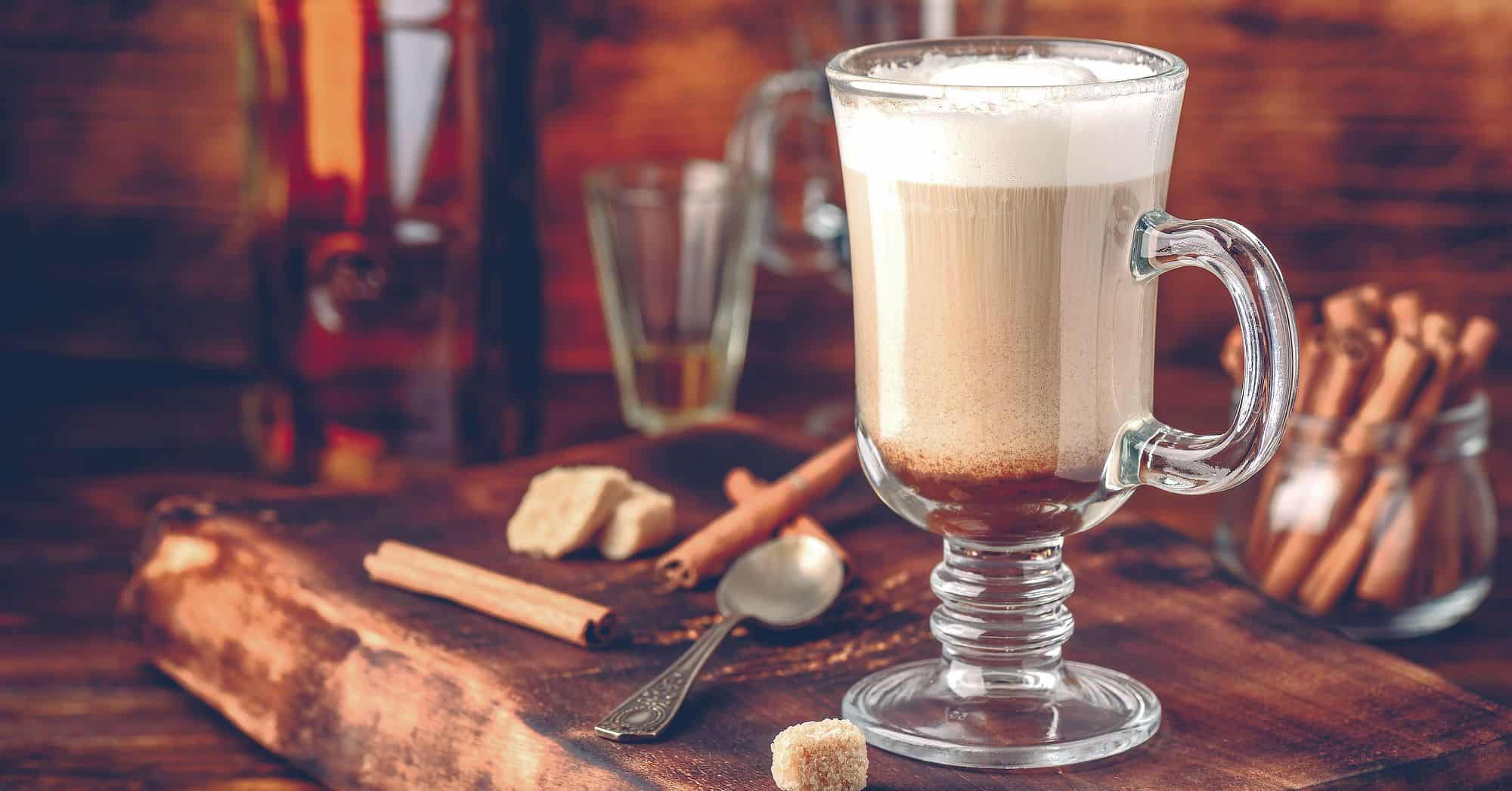 Irish coffee cocktail in glass on bar