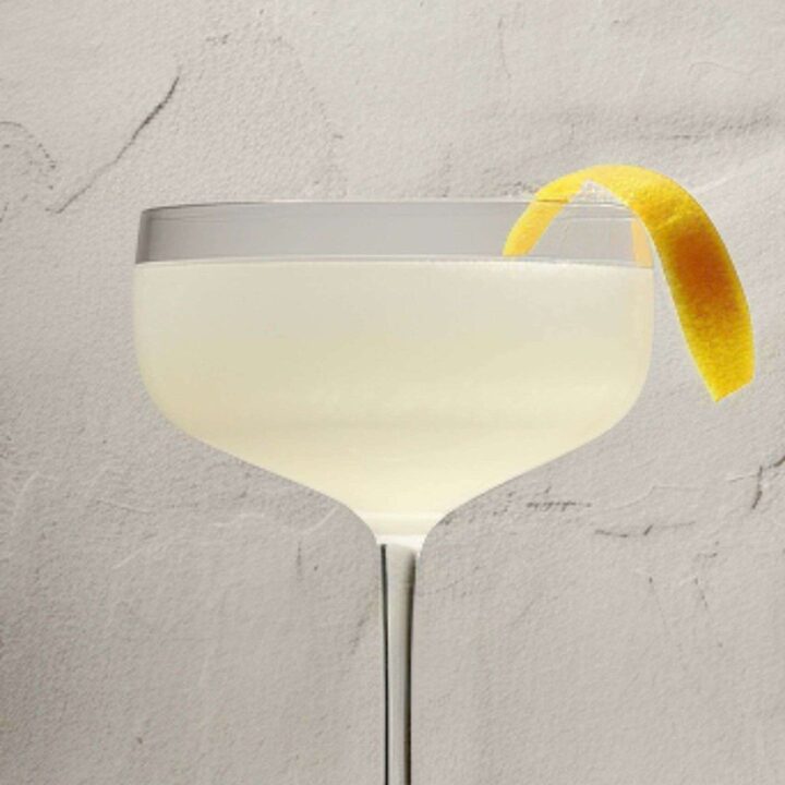 Corpse Reviver No. 2 cocktail in coupe glass with orange twist