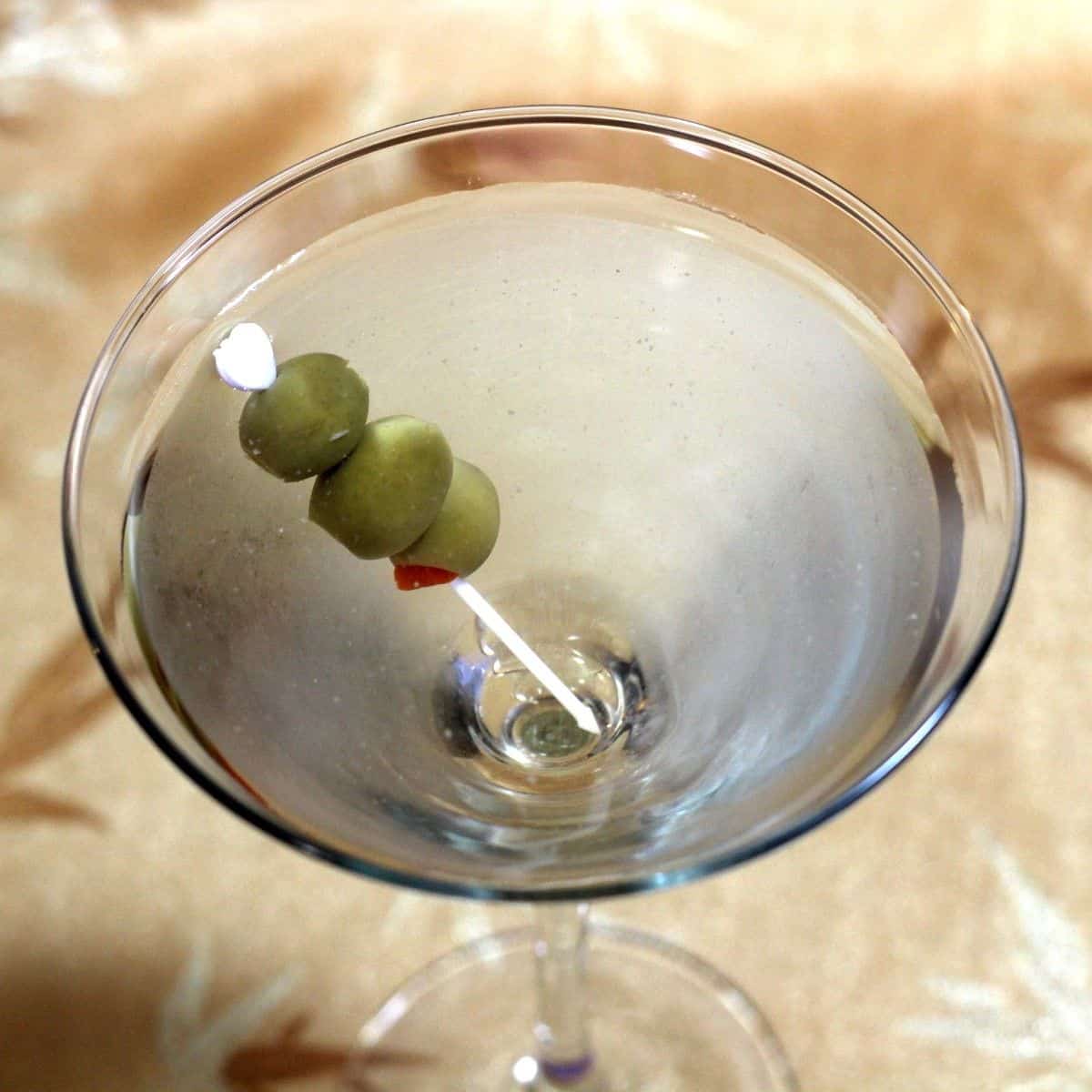 Dirty Martini drink with olives