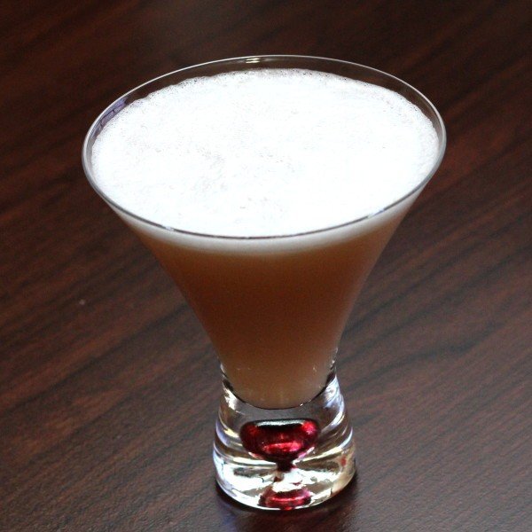 Douglas Fairbanks cocktail in stemless martini glass on bar top