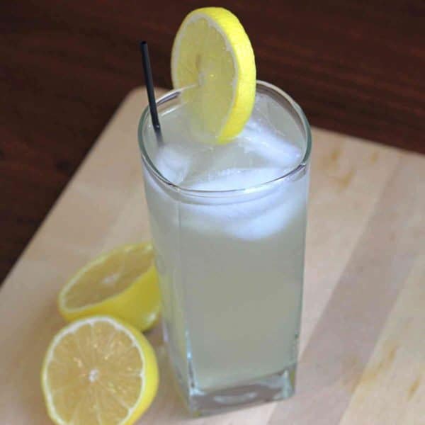 Electric Fuzzy drink beside lemon halves