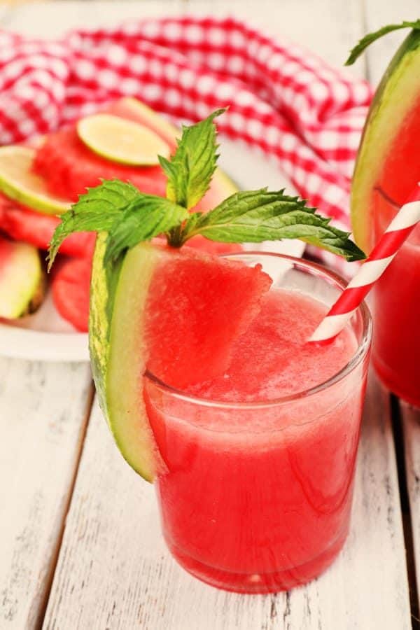 Fresh Watermelon 'Rita on picnic table in front of plate of watermelon