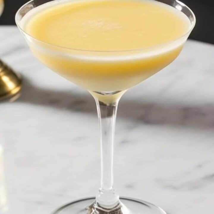 Golden Dream cocktail in coupe glass on table