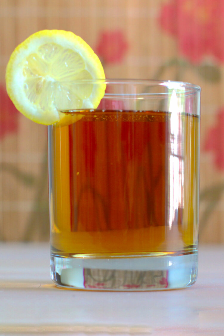 Grand Apple drink with lemon wheel