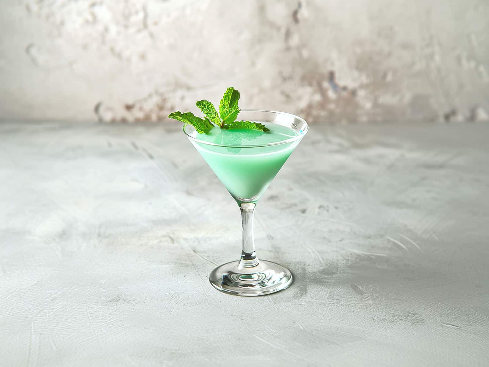 Creamy green Grasshopper drink with mint sprig