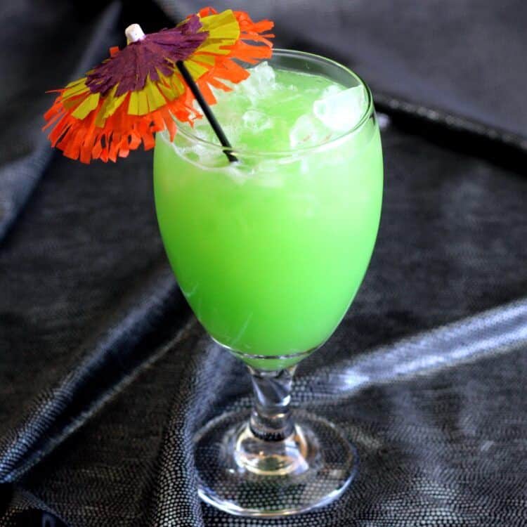 Green Eyes Drink with colorful cocktail umbrella