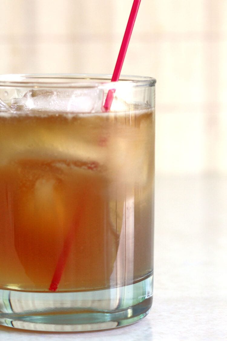 Closeup of Grumpy Old Man drink on table with red straw