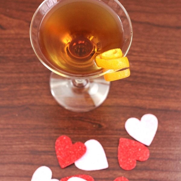 Overhead view of Hanky Panky Cocktail on a table with decorative hearts