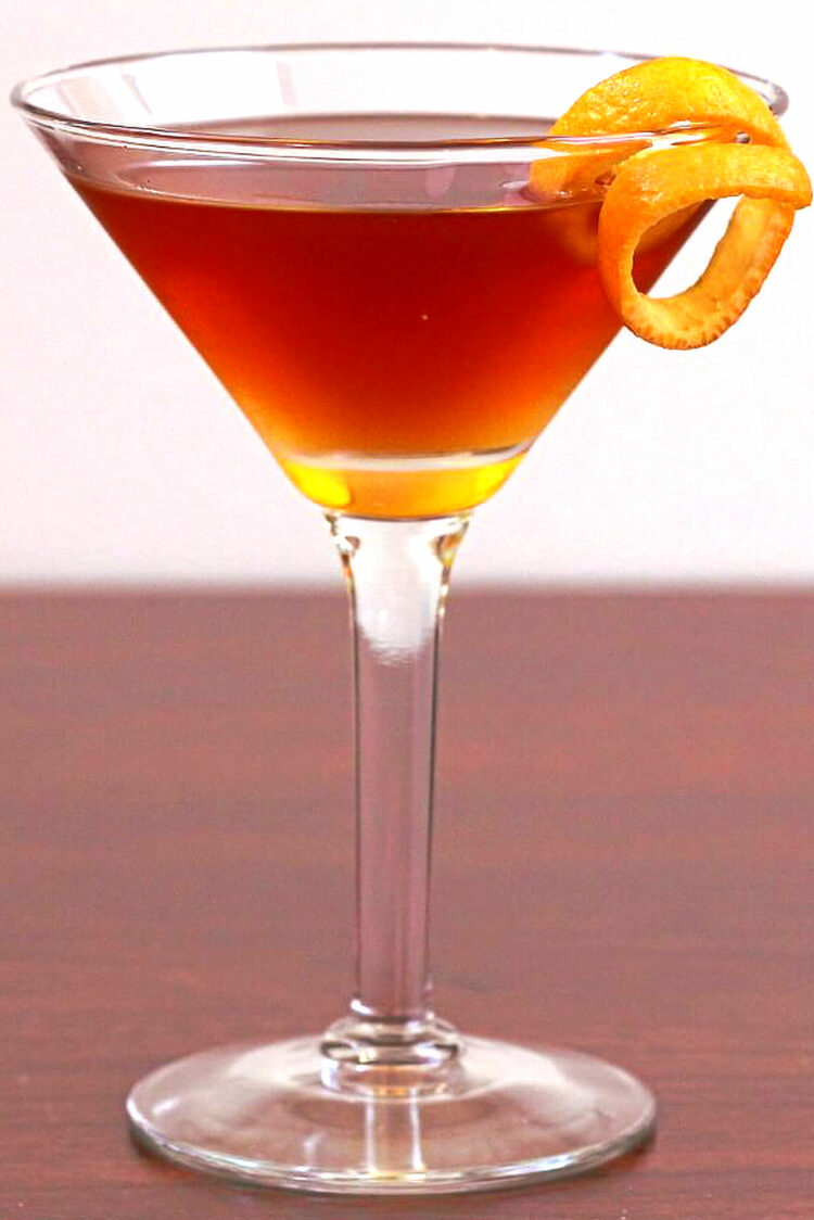 Hanky Panky Cocktail on table with orange twist