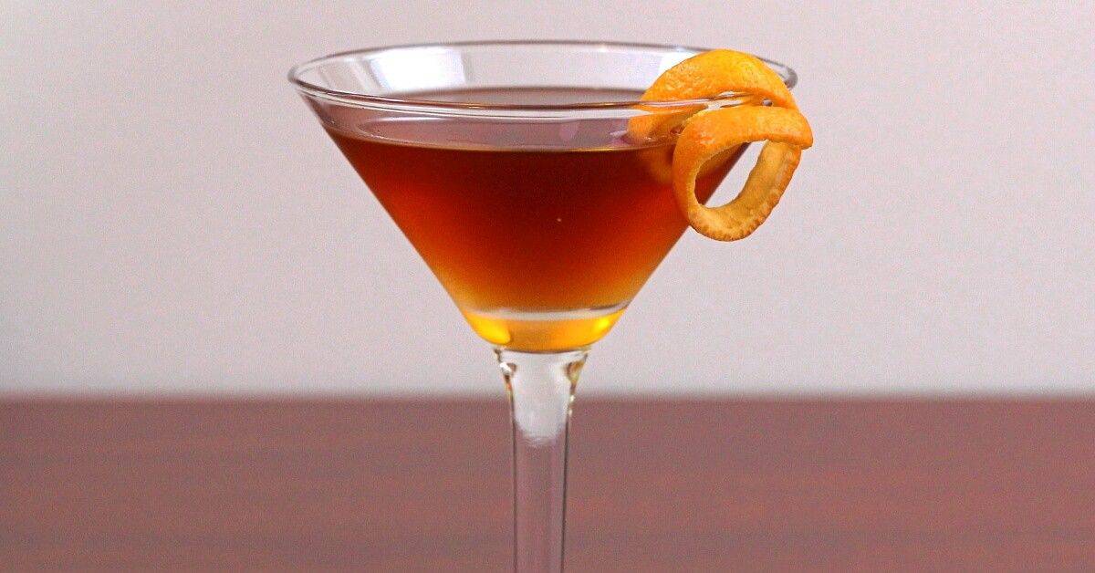 Hanky Panky Cocktail on table with orange twist