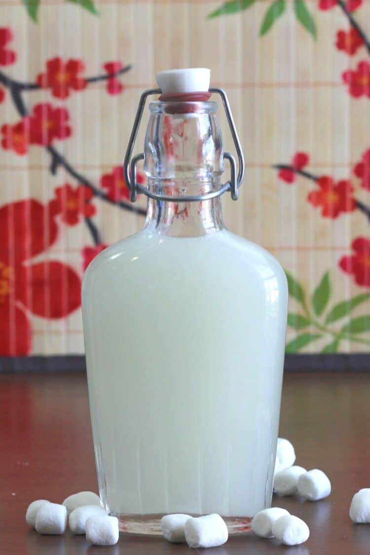 Homemade marshmallow liqueur in glass bottle