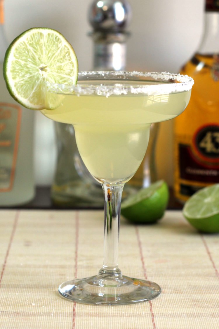 Honey Vanilla Margarita in front of liquor bottles