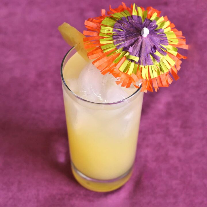 Honolulu Coller drink with pineapple and colorful umbrella