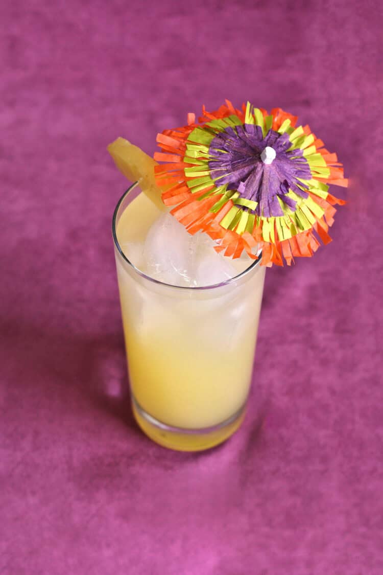 Honolulu Coller drink with pineapple and colorful umbrella