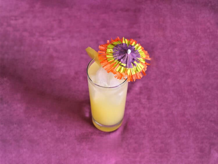 Honolulu Coller drink with pineapple and colorful umbrella