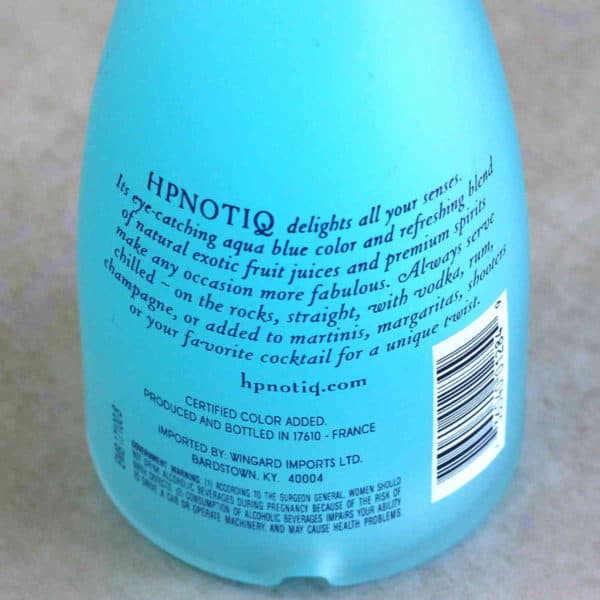 Closeup of paragraph on back of bottle of Hpnotiq