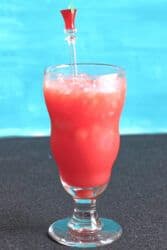 Red mocktail in a hurricane glass