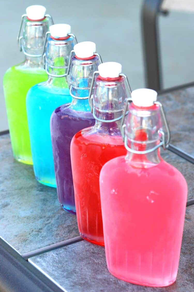 Jolly Rancher Vodka chilled in frosty flasks on patio table