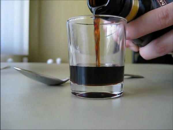 Pouring first layer of cocktail