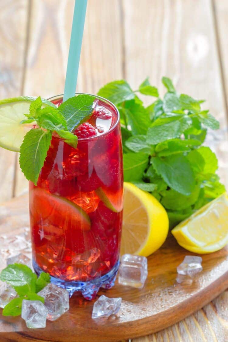 Long Beach Iced Tea with raspberries, mint and lime garnish