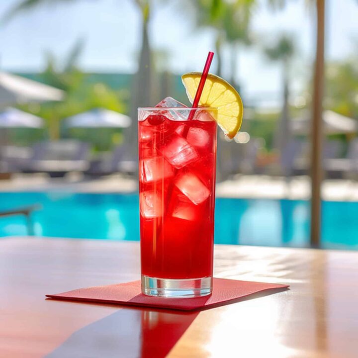 Long Beach Iced Tea cocktail on table in front of beach