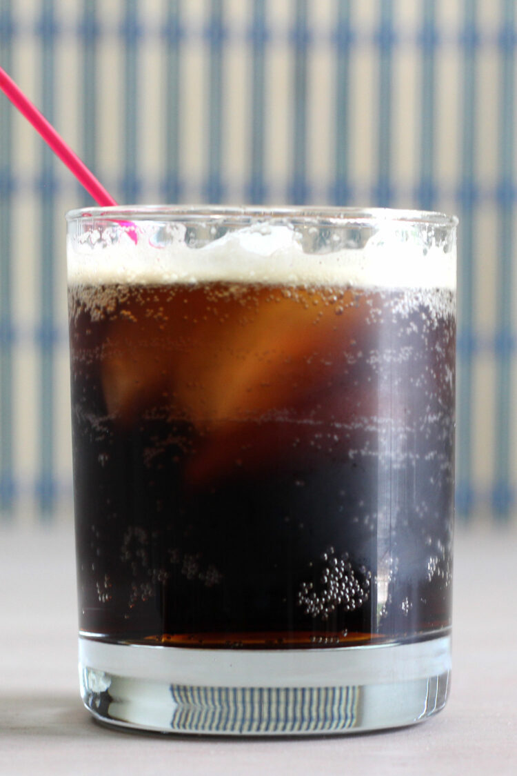 Long Black Russian cocktail served with red straw