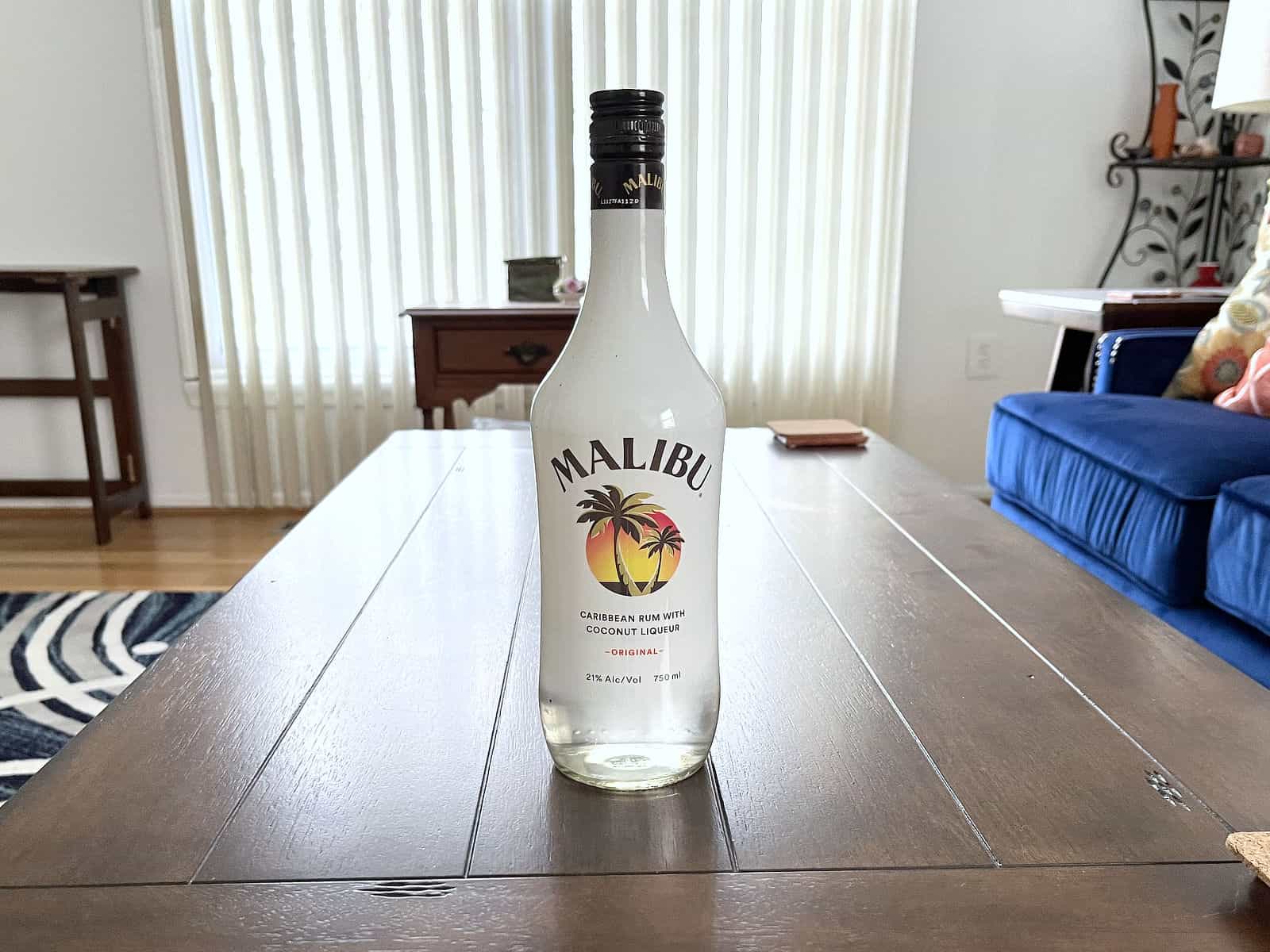 Bottle of Malibu Rum on wooden table