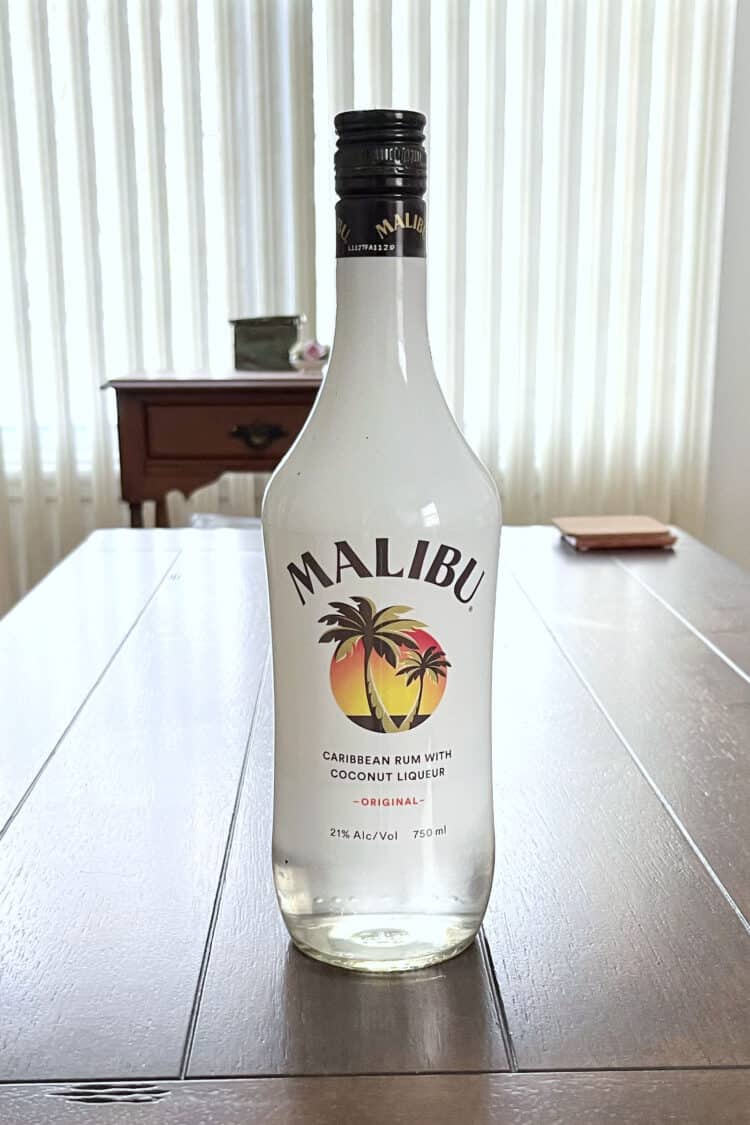 Bottle of Malibu Rum on wooden table